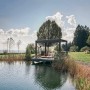 Biohort Pergola in Dunkelgrau/Silber-Metallic am See, Paar entspannt auf Liegen.