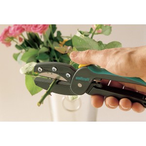 Wolfcraft Megacut Allesschneider in Aktion beim Schneiden eines Rosenstiels.