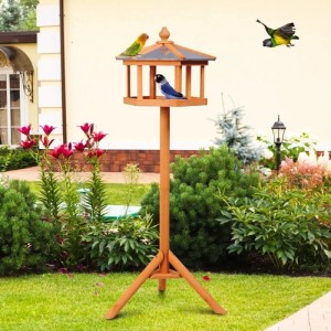 PawHut Vogelhaus aus Holz mit Ständer und 6-eckigem Zinkdach im Garten. Zwei Vögel am Futterhaus.