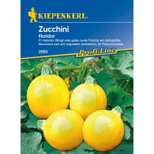 Kiepenkerl Profi-Line Zucchini Floridor: Gelbe, runde Zucchini-Früchte im Beet.