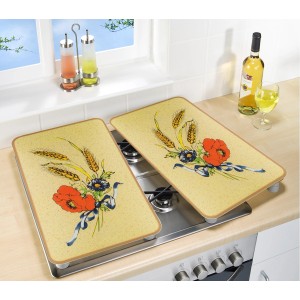 Wenko Herdabdeckplatten 2er Set Kornblumen auf Herd, gelber Hintergrund mit Blumenmotiv.