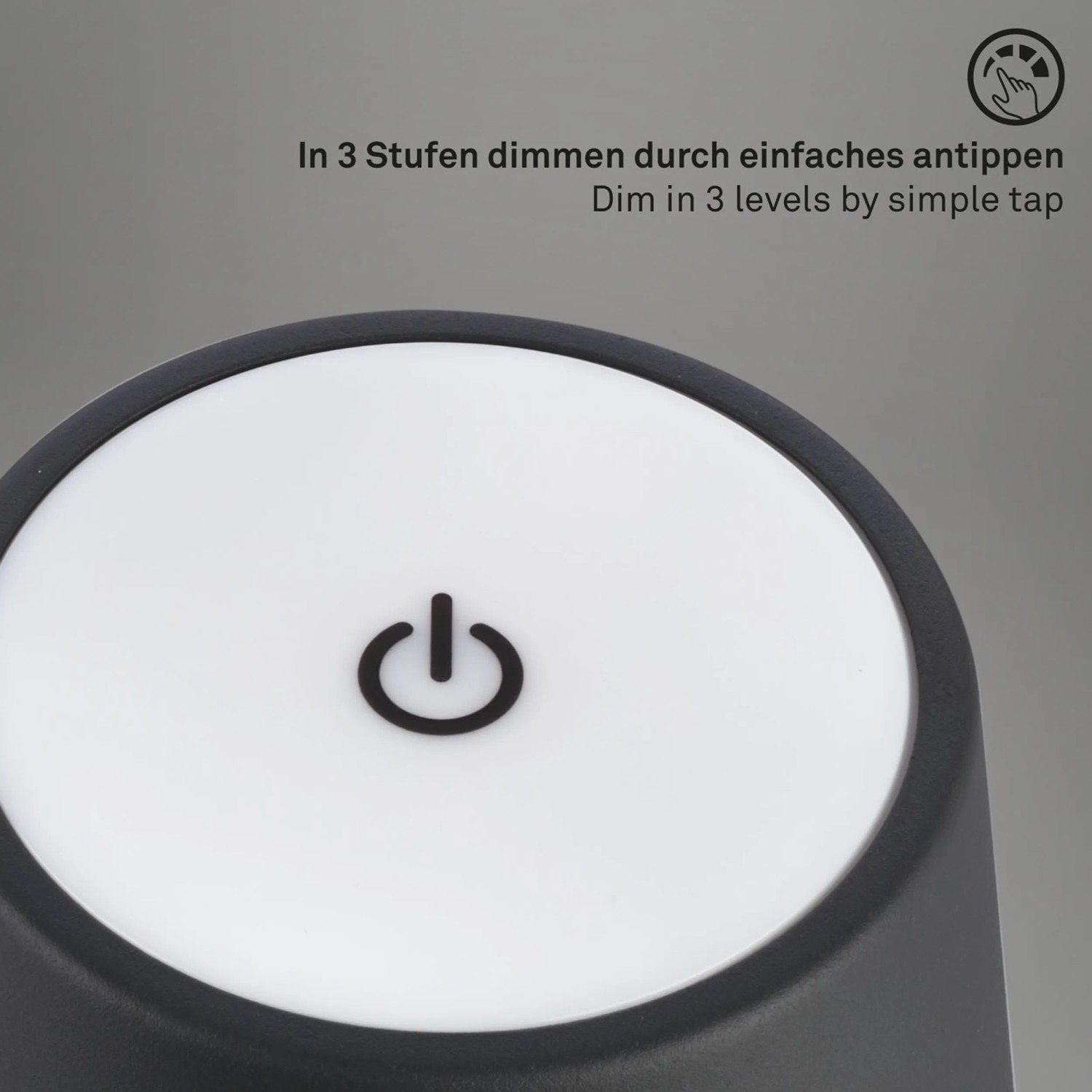 Detailaufnahme: Schwarze Brilo Akku-Tischleuchte mit Touchdimmer und An/Aus Symbol.