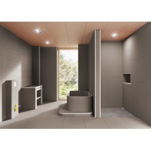 Badezimmer mit grauen Fliesen, Badewanne und Waschtisch. Ultrament Montagekleber für Bau- & Fliesenlegerarbeiten.