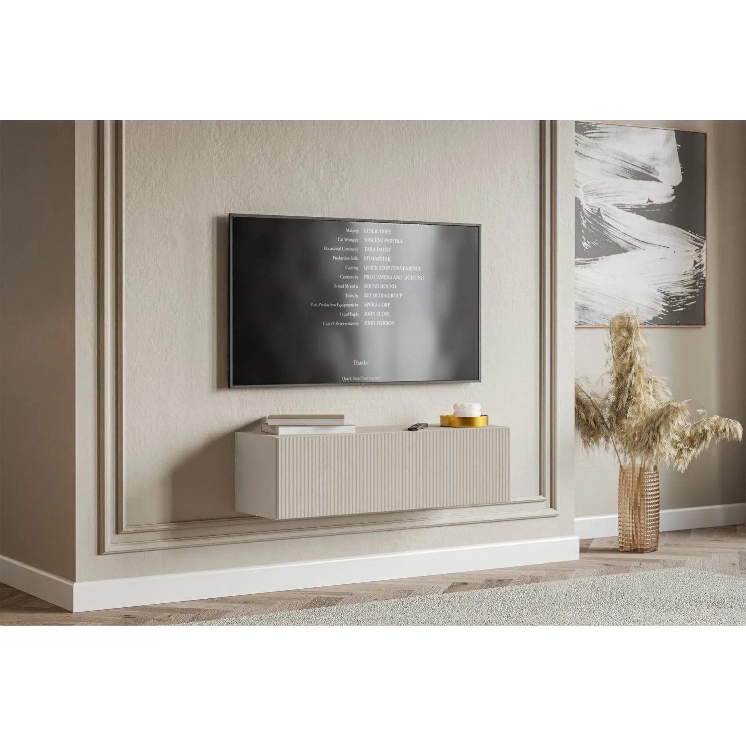 Selsey Veldio TV-Hängeboard 100 cm in Greige mit geriffelter Lamellenfront, schwebend unter TV im Wohnzimmer.