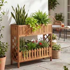 MCW Hochbeet aus braunem Akazienholz, 90x95x31cm, mit zwei Pflanzebenen, Rankgitter und Ablage auf Terrasse.