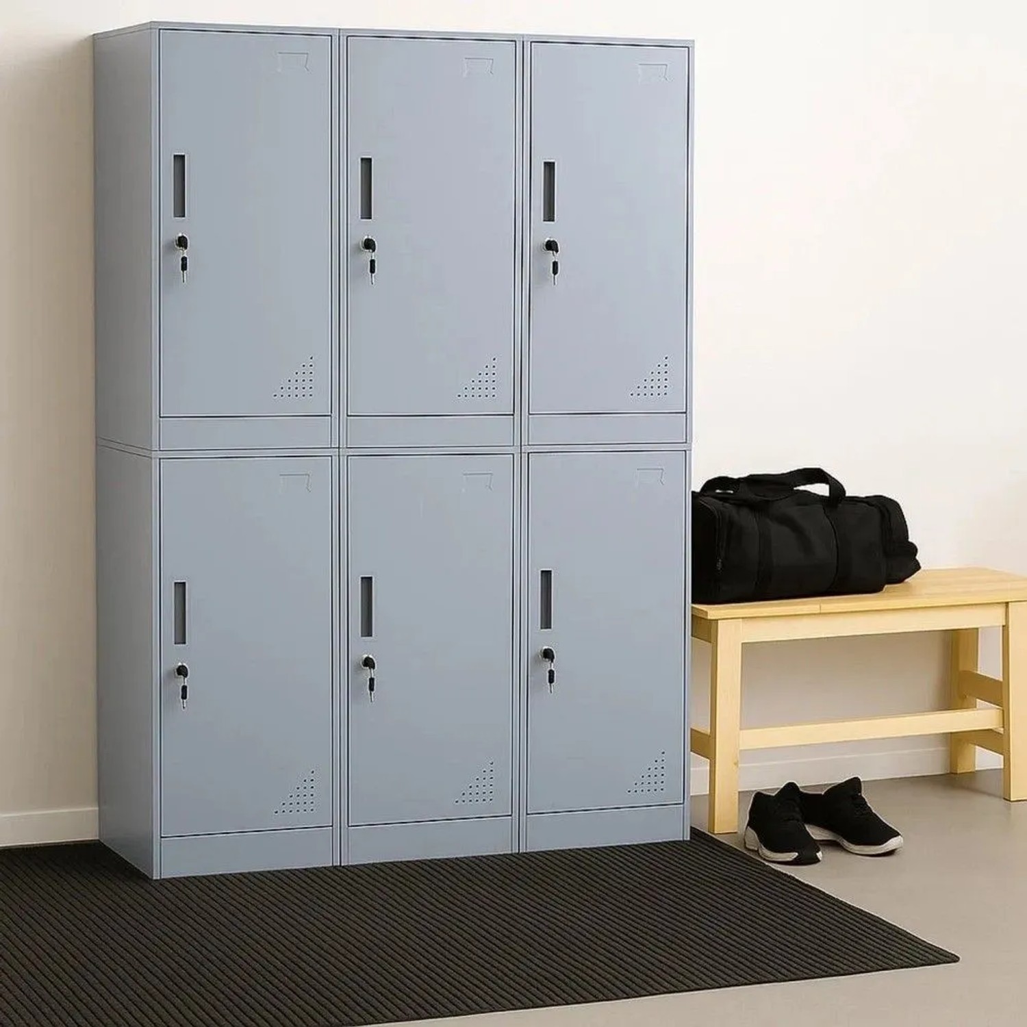 Grauer MCW Spind P63, ein Büroschrank aus Stahl mit Fächern und abschließbaren Türen.