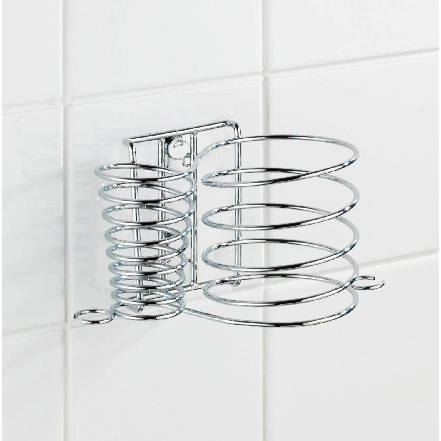 Wenko Haartrockner- & Glätteisenhalter Milano aus verchromtem Metall an weißer Wand.