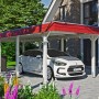 Weißer Skan Holz Carport Wendland mit roter Blende und EPDM-Dach, passend zum Haus.