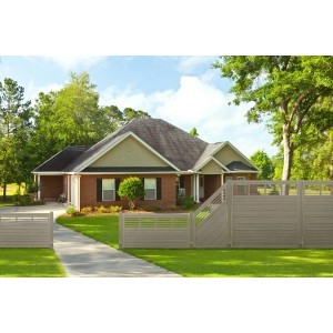 Grauer Sichtschutzzaun Nicea (180x180cm) aus lasiertem Kiefernholz vor einem Haus.