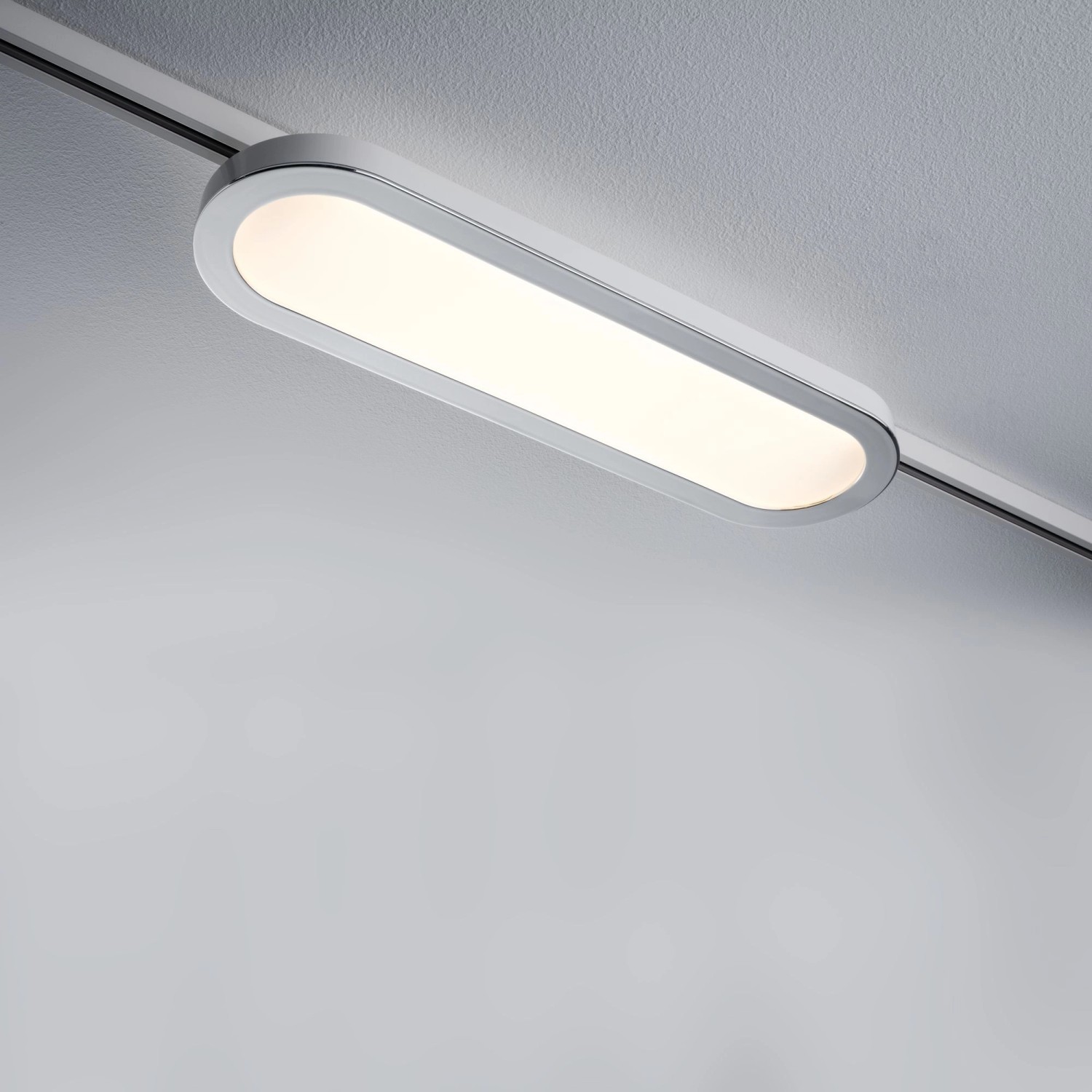Weißes Paulmann URail LED Panel Loop (7W) an einem Schienensystem. Warmweißes Licht.