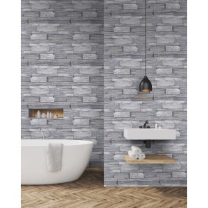 Superfresco Easy Vliestapete Stone Wall Grey im Badezimmer mit Badewanne und Waschbecken.