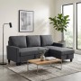 Dunkelgraues Ecksofa mit Schlaffunktion und Stauraum-Chaiselongue im modernen Wohnzimmer. Vielseitiges Schlafsofa.