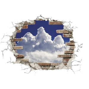 Komar Deko-Sticker Break Out Clouds, Wandtattoo mit Wolken und Himmel durch eine Backsteinmauer.