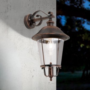 Rustikale Orion Außen Wandleuchte in Schwarz-Kupfer mit Laternen-Design und klarem Glas, ideal für Fassaden.
