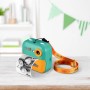 DieMaus Sofortbildkamera für Kinder in Grün-Orange mit Trageriemen und ausgedrucktem Schwarz-Weiß-Foto.