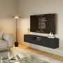 Schwarzes Selsey TV-Hängeboard Framme 150 cm mit offener Ablage und grifflosen Fronten im modernen Wohnzimmer.
