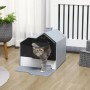 Graue PawHut Katzentoilette in Hüttenform mit weißer Bodenwanne, Katze tritt heraus. Inkl. Schaufel.