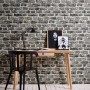 A.S. Creation Vliestapete Neue Bude 2.0 Bruchstein Grau an Wand hinter Schreibtisch.