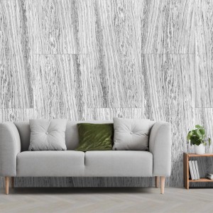 Graues Marmor Echtstein-Paneel als Wandverkleidung hinter Sofa. Naturstein-Optik für stilvolle Wohnräume.