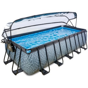 Rechteckiger EXIT Stone Pool in Grau mit Abdeckung, Sandfilterpumpe und Wärmepumpe.