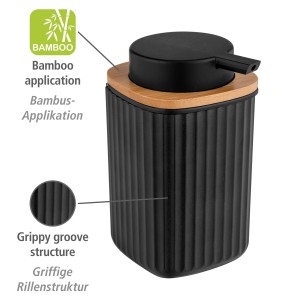 Schwarzer WENKO Seifenspender Rotello mit Rillenstruktur und Bambusapplikation.