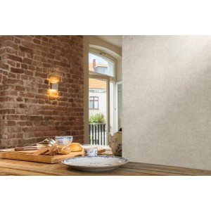 A.S. Création Vliestapete Paradise Garden Uni Beige-Creme an einer Wand im Wohnraum.