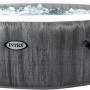 Intex PureSPA Greywood Deluxe aufblasbarer Whirlpool, grau, mit Bedienfeld und Wasser.
