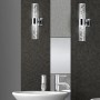 Chromfarbene Trio LED-Bad-Wandleuchte Bubbles mit klarem Acrylglas und dekorativen Luftblasen.