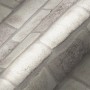 A.S. Création Vliestapete in Grau mit Ziegelstein-Optik, leicht strukturierte Oberfläche.
