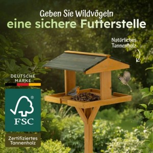 Moorland Vogelhaus aus Tannenholz mit Futter und zwei Vögeln im Garten.