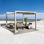 Weka Sonnendach Gartenoase 235 Elfenbein mit Sitzgruppe auf Holzterrasse am Strand.