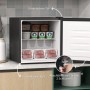 Schwarzer HOMCOM Mini-Gefrierschrank 35 L, offen, mit Lebensmitteln. Zeigt umkehrbare, abschließbare Tür und verstellbaren Fuß.