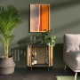 Wohnraum mit Wandfarbe in Piniengrün von CREATE! by OBI. Dekoriert mit Schrank, Pflanzen und Bild.