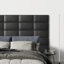 Wandkissen Rechteck, 60x30 cm, Dunkelgrau in Leder-Optik als Wandpaneel hinter einem Bett.