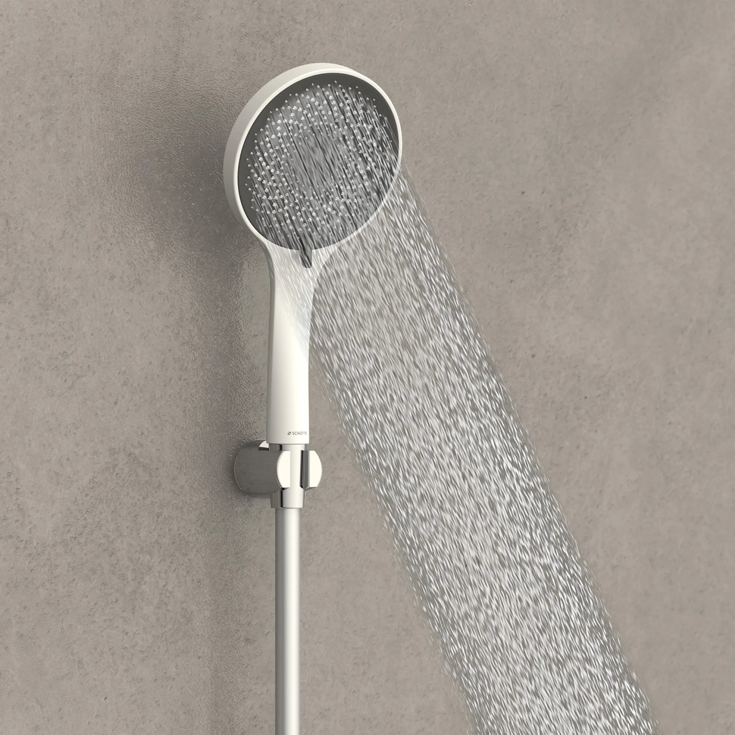 Schütte Handbrause Capri, weiß matt-anthrazit, mit Wasserstrahl an Duschstange.