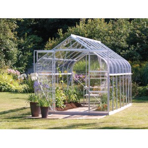 Vitavia Gewächshaus Diana 11500 mit Alu-Rahmen, Glas und Pflanzen im Garten.