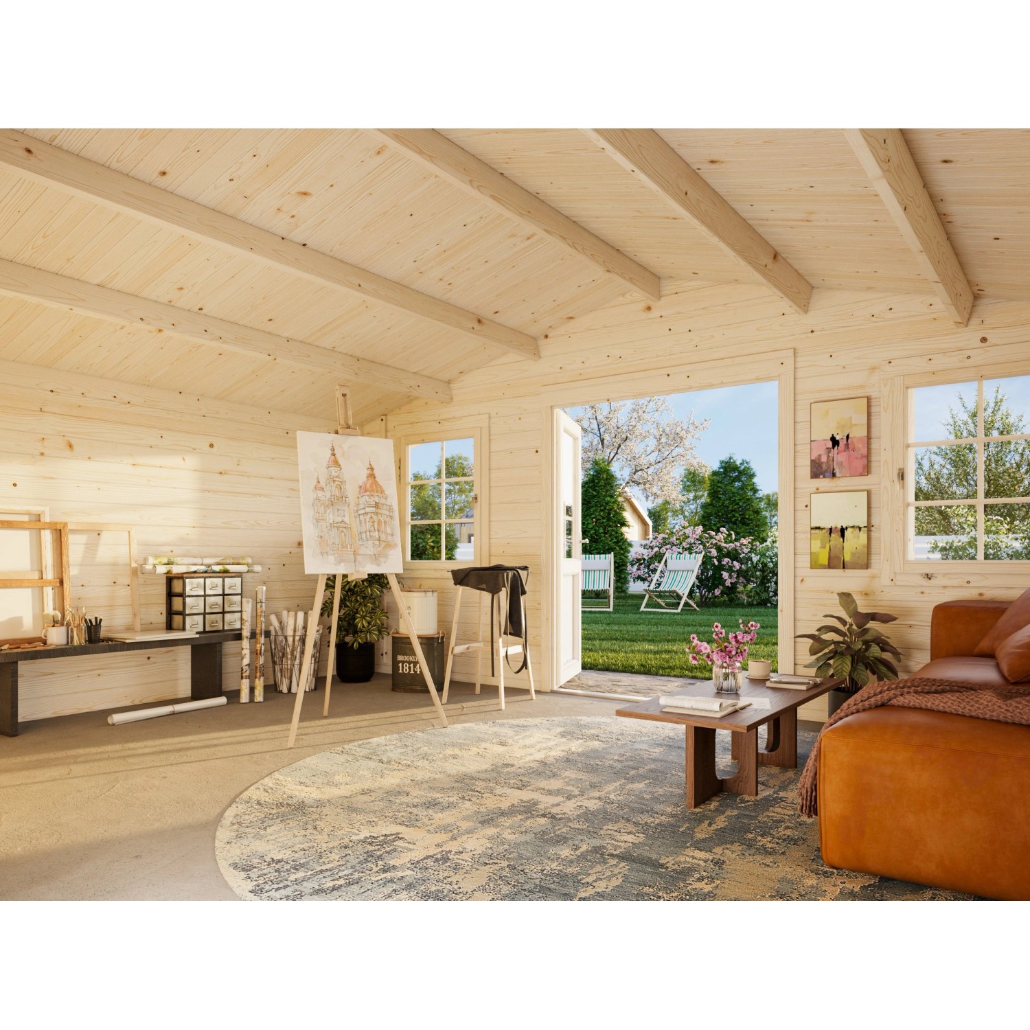 Innenansicht: Hellgraues Palmako Gartenhaus Klara mit Malstaffelei und Wohnbereich.