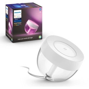 Philips Hue Iris Tischleuchte, weiße Lampe mit Farbwechselfunktion, neben Produktverpackung.