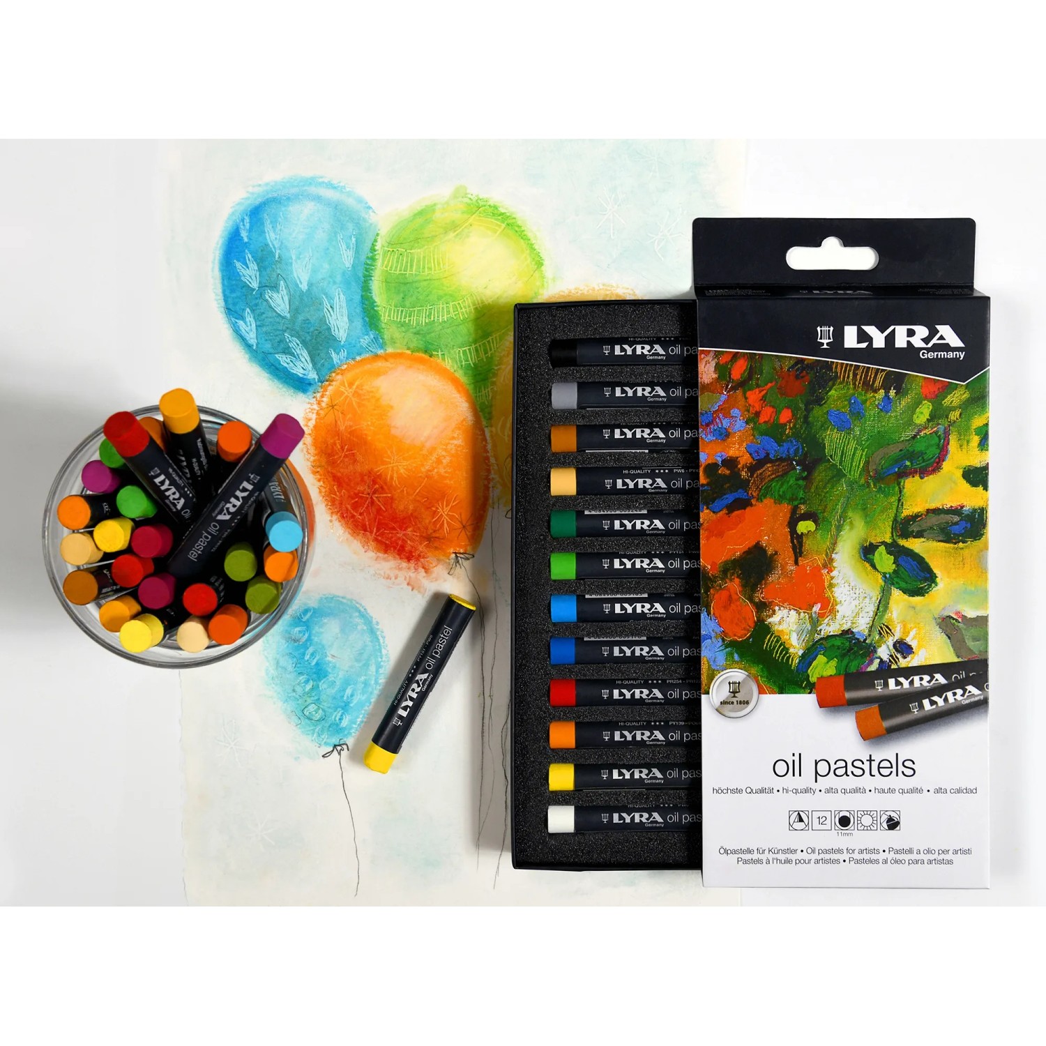 Lyra Öl-Pastellkreiden, 12 Farben im Kartonetui, mit Farbbeispielen und Verpackung.