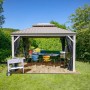 Sojag Pavillon Messina 12x16 Champagner mit Tisch und Stühlen im Garten.