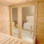 Weka Massivholzsauna Bergen mit Glastür und Fenster, Innenansicht mit Liege.