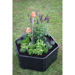 Anthrazitfarbener KHW Komposter SK 550 l, bepflanzt mit Kräutern und Blumen.