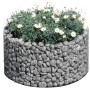 Rundes Bellissa Gabionen-Hochbeet Basic mit grauer Steinfüllung und weißen Margeriten.
