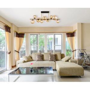 Moderne Globo LED-Deckenleuchte Riha, 9-flammig, schwarz matt mit amberfarbenen Glaskugeln.