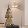 Komar Deko-Sticker Buddha (100x70cm) als Wandtattoo im Wohnraum mit Lampe und Hocker.