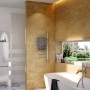 Nordholm Designheizkörper Shift, Edelstahl hochglanz, mit schwenkbaren Querrohren im Badezimmer.