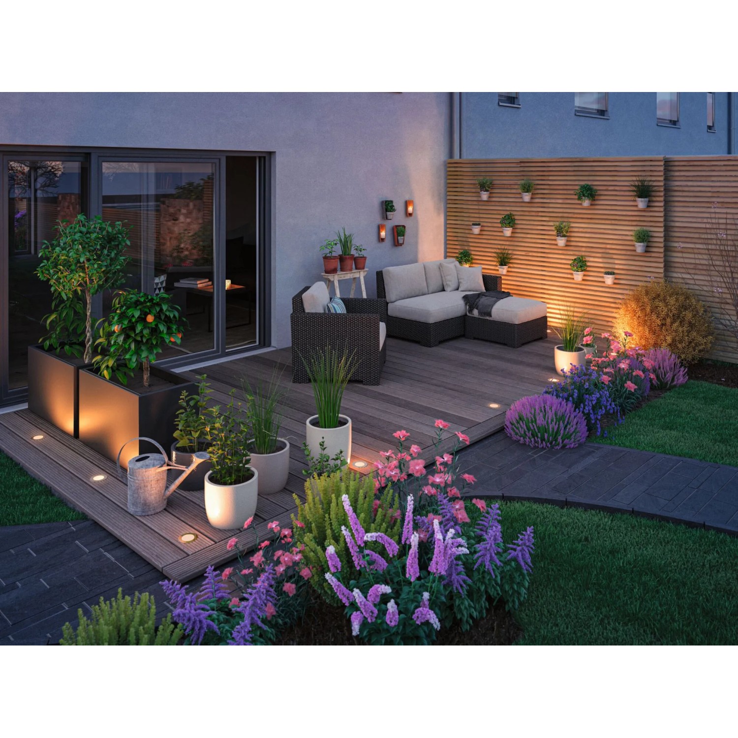 Beleuchtete Terrasse mit Paulmann LED Bodeneinbaustrahlern und Gartenmöbeln.
