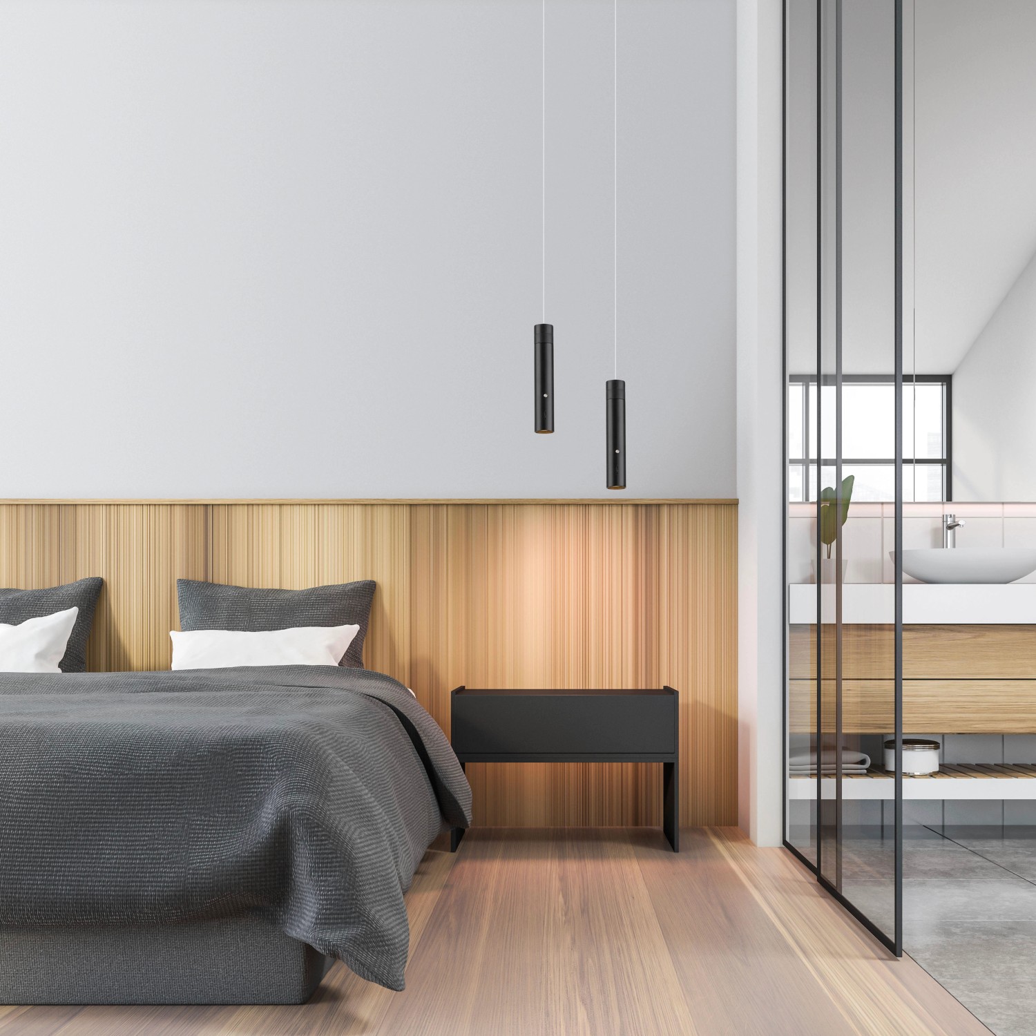 Schwarze LED-Akku-Pendelleuchte Attach (120 cm) über einem Bett im Schlafzimmer.