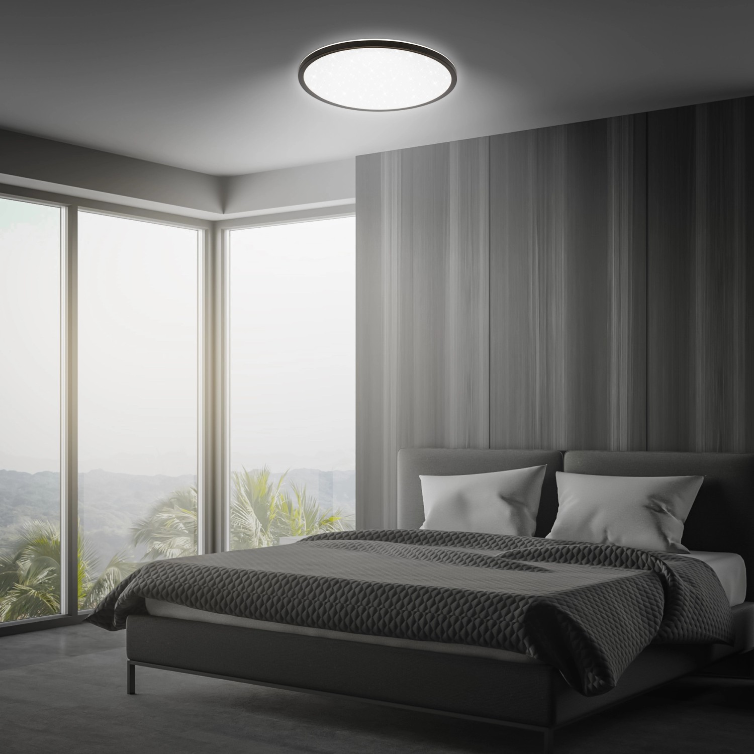 Schwarzes Brilo LED-Panel Slim Sternenhimmel, neutralweiß, Ø 37,5 cm, montiert in einem Schlafzimmer.