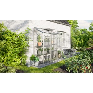 Vitavia Anlehn-Gewächshaus Ida 1300 aus Aluminium mit ESG Glas an Hauswand im Garten.